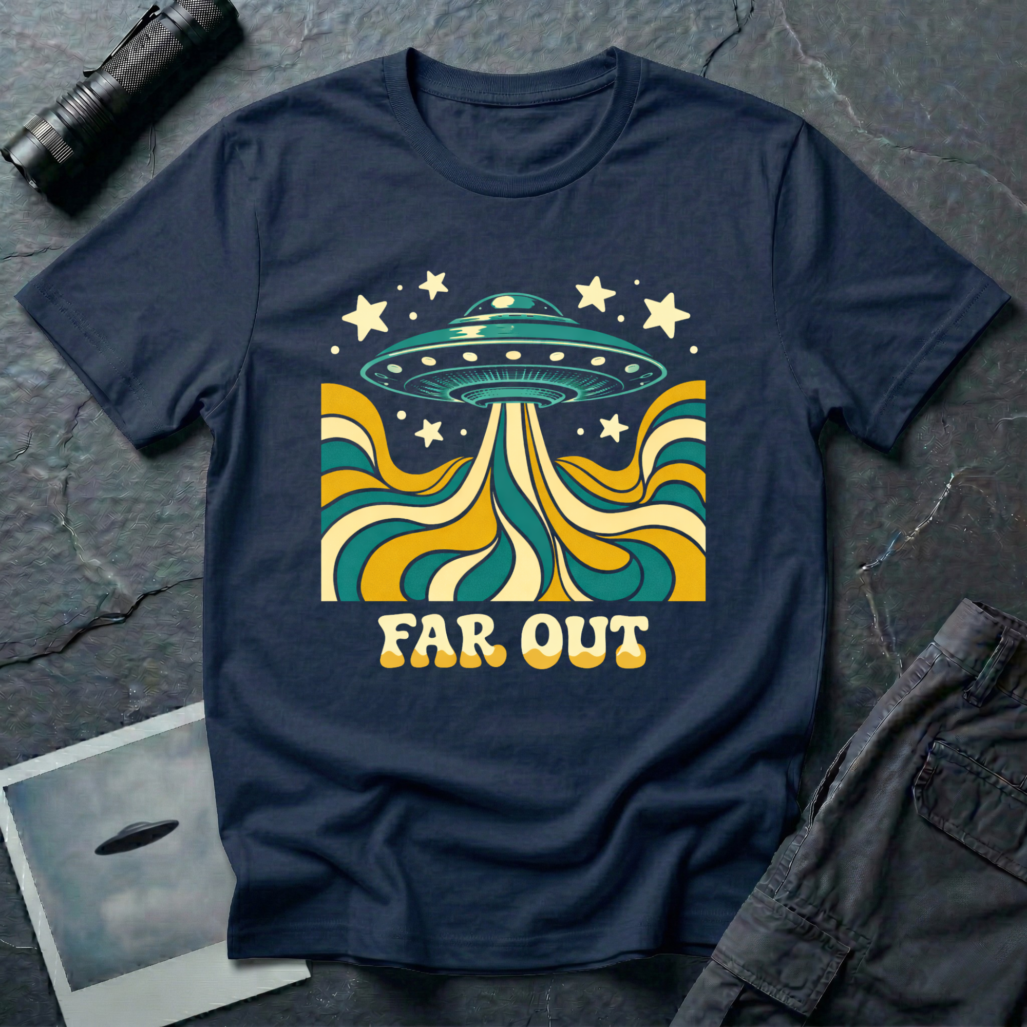 Far Out psychedelic UFO t-shirt — flying saucer with swirling teal and mustard beam and "Far Out" bubble type on navy cotton tee
