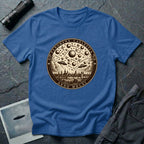 Royal blue t-shirt with a sepia engraving medallion depicting the 1561 Nuremberg UFO phenomenon with craft, spheres and the words FENOMENA CAELESTIA ANNO MDLXI