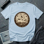Light blue t-shirt with a sepia engraving medallion depicting the 1561 Nuremberg UFO phenomenon with craft, spheres and the words FENOMENA CAELESTIA ANNO MDLXI