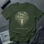  Flora From Afar botanical UFO t-shirt — Victorian-style flying saucer overgrown with flowers and vines in cream line-work on green cotton tee