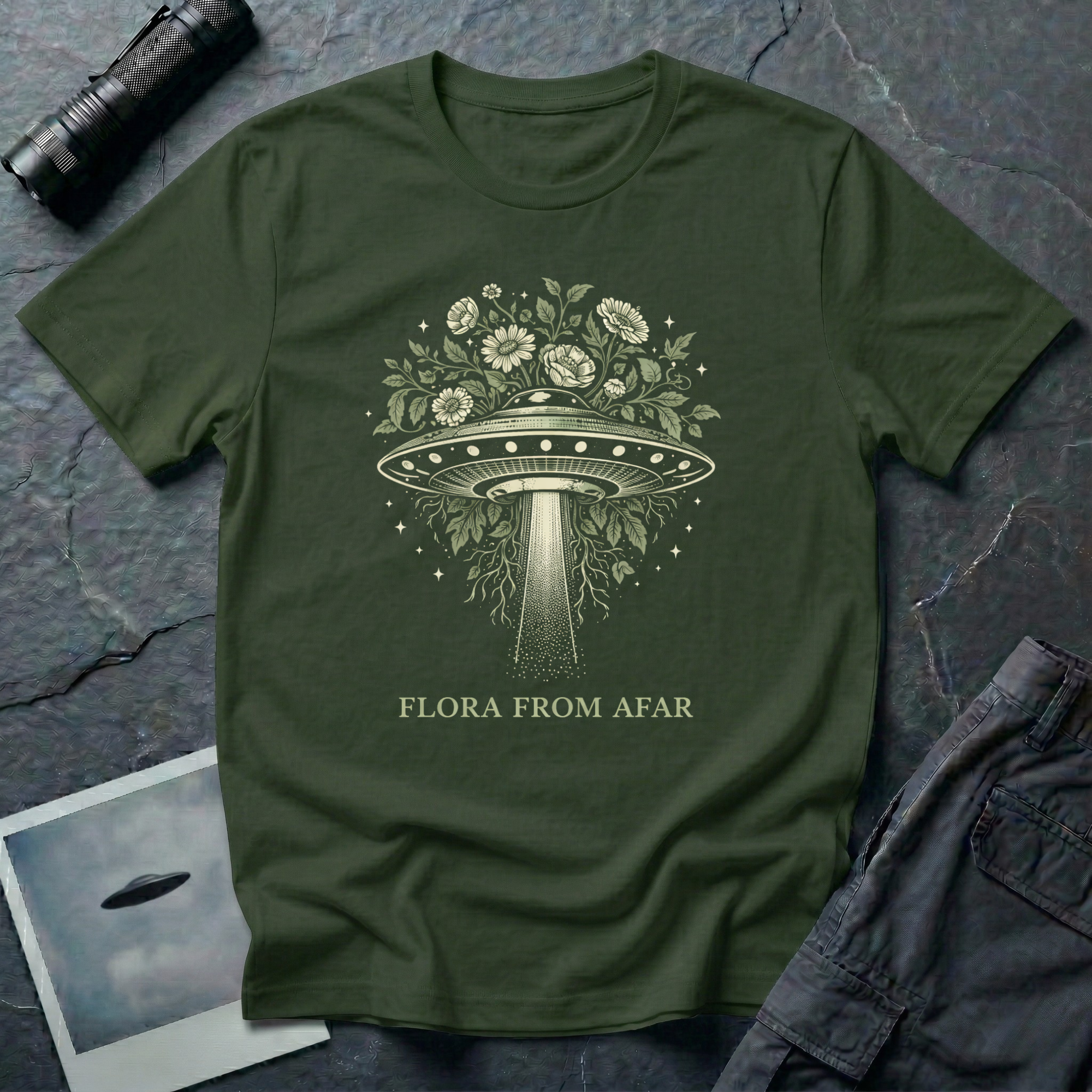  Flora From Afar botanical UFO t-shirt — Victorian-style flying saucer overgrown with flowers and vines in cream line-work on green cotton tee