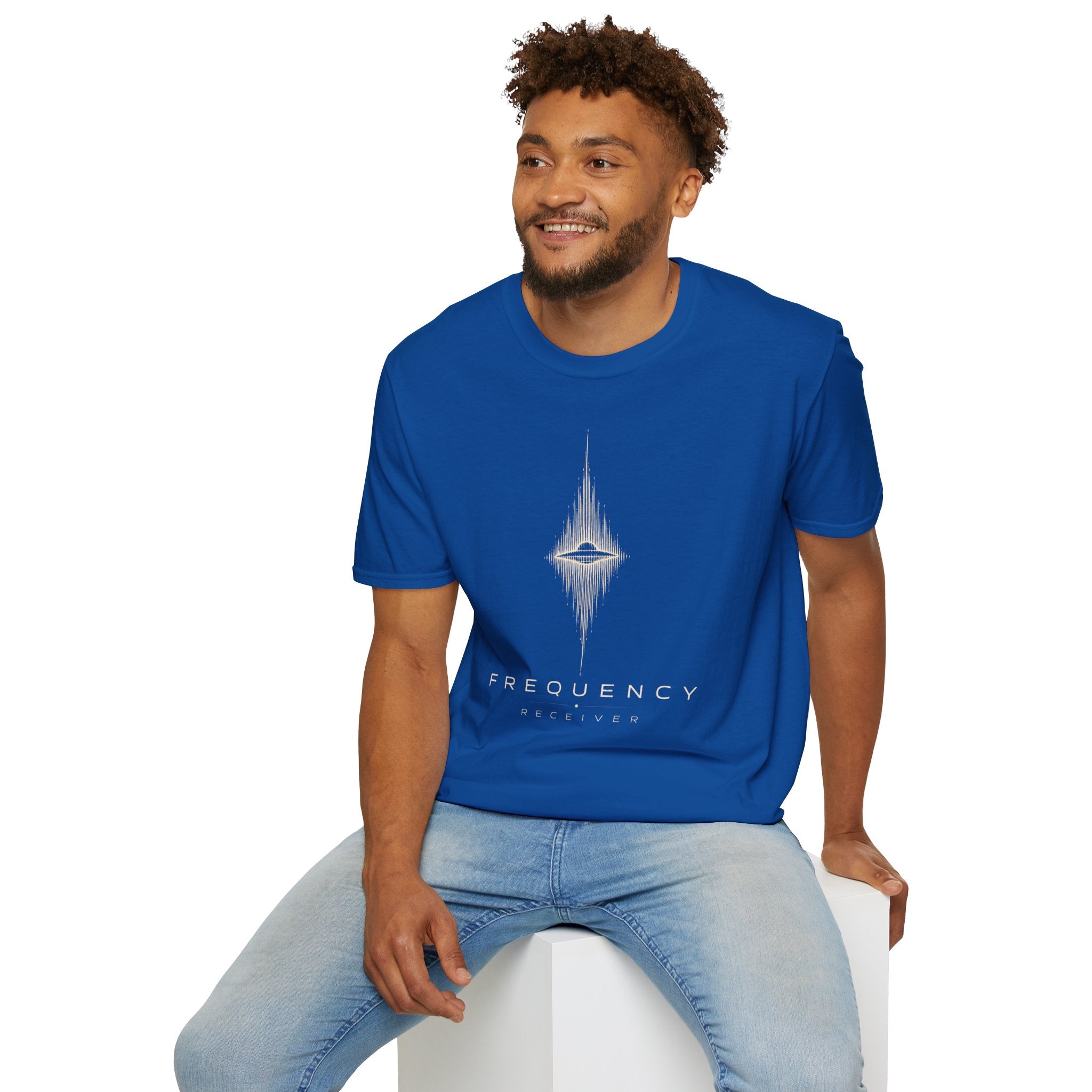 Man wearing blue UFO t-shirt with a flying saucer at the centre of a diamond-shaped frequency waveform in cream with the words FREQUENCY RECEIVER beneath