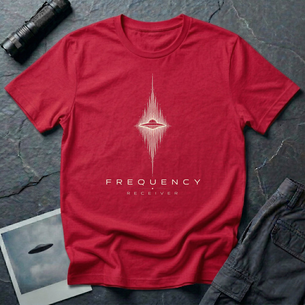 Red UFO t-shirt with a flying saucer at the centre of a diamond-shaped frequency waveform in cream with the words FREQUENCY RECEIVER beneath