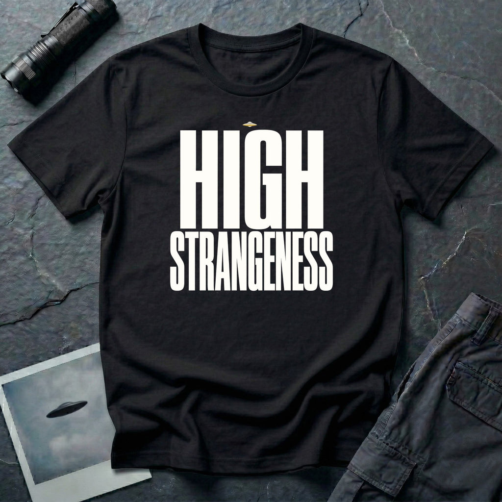 Black t-shirt with bold white High Strangeness text and small UFO above the lettering