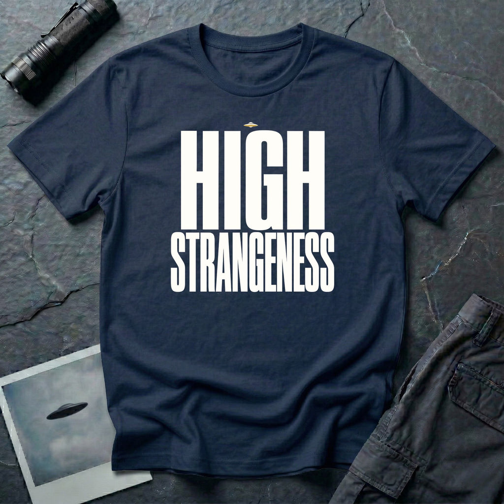 Navy blue t-shirt with bold white High Strangeness text and small UFO above the lettering