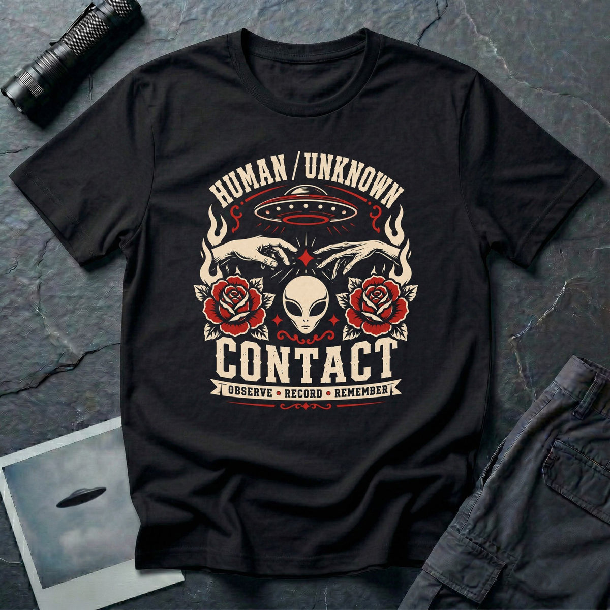 Black t-shirt with traditional tattoo style alien head, roses, UFO, and reaching hands with Human Unknown Contact Observe Record Remember text