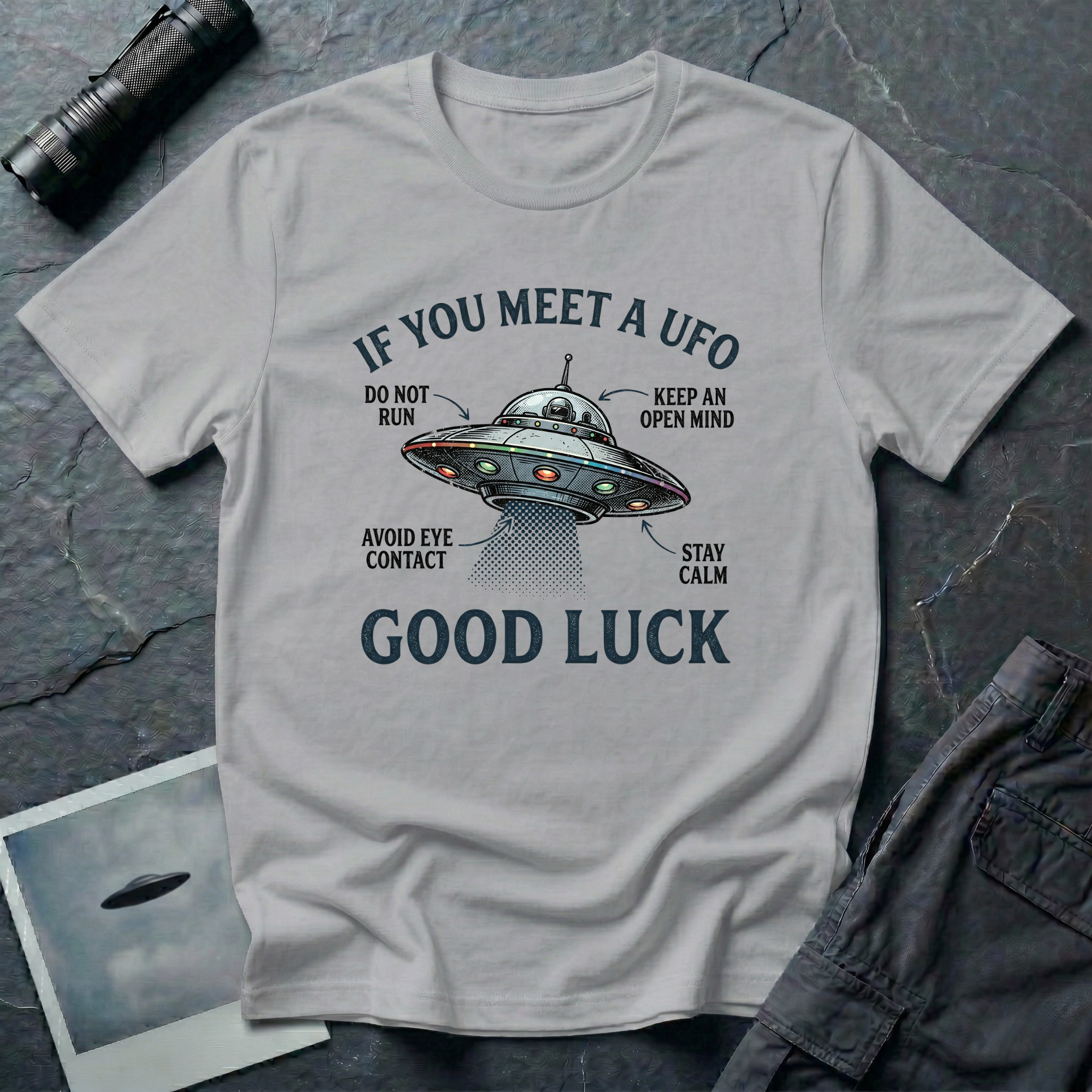 If You Meet A UFO funny UFO t-shirt — flying saucer with deadpan safety instructions on grey unisex cotton tee