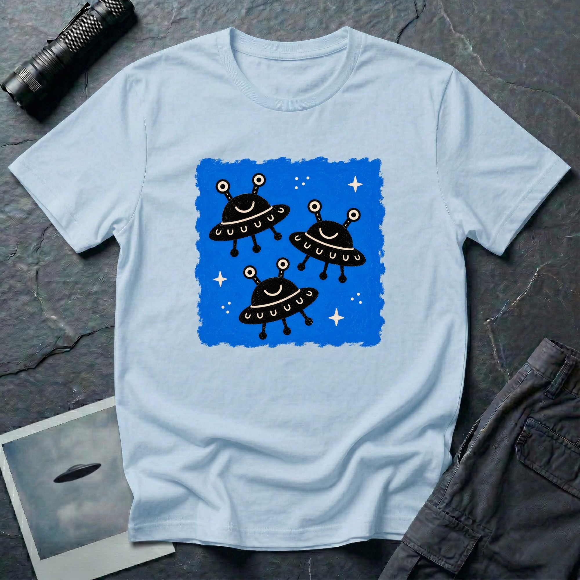 Little Visitors The Fleet UFO t-shirt with three smiling black saucers in formation on blue