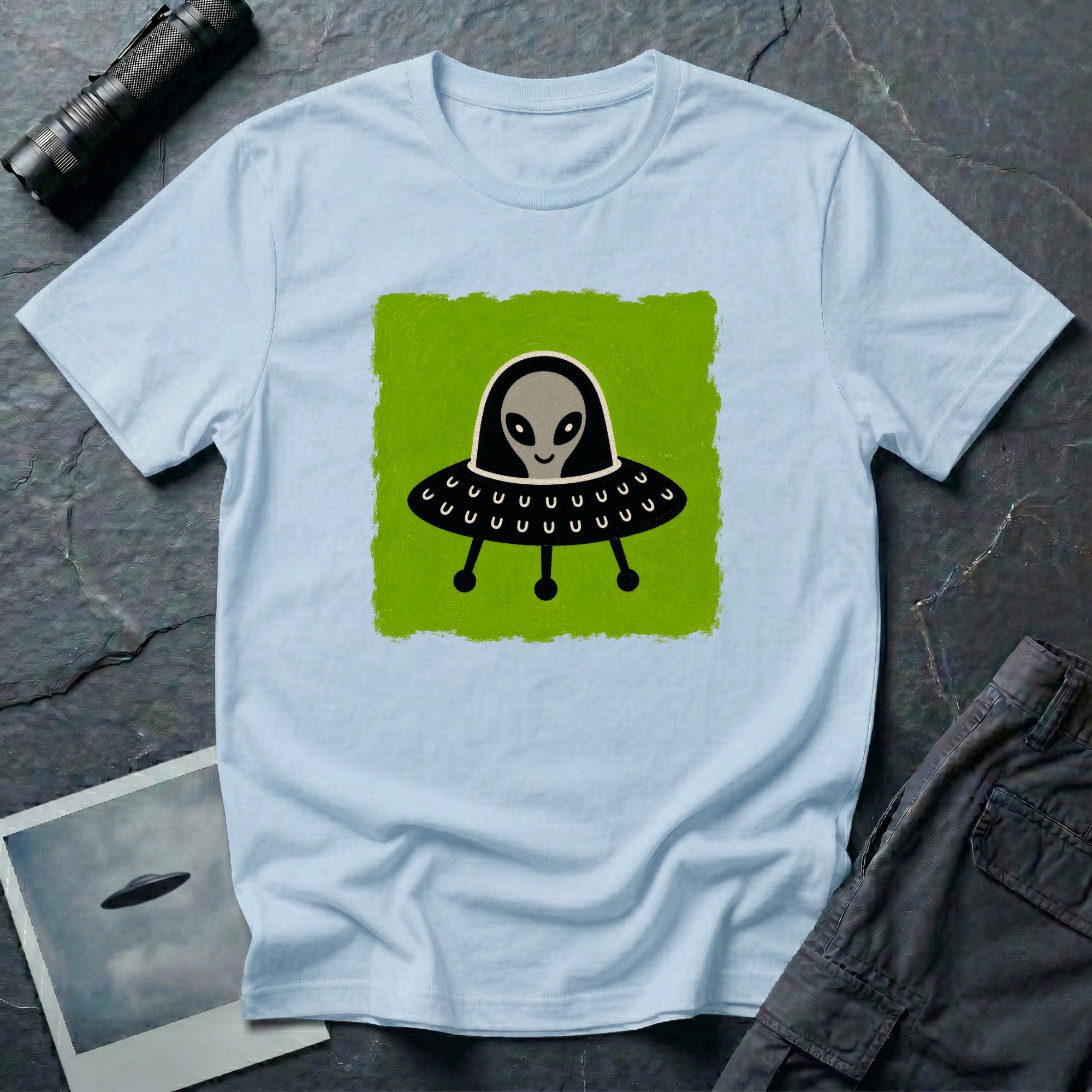 Little Visitors The Pilot UFO t-shirt with friendly grey alien in black saucer on green