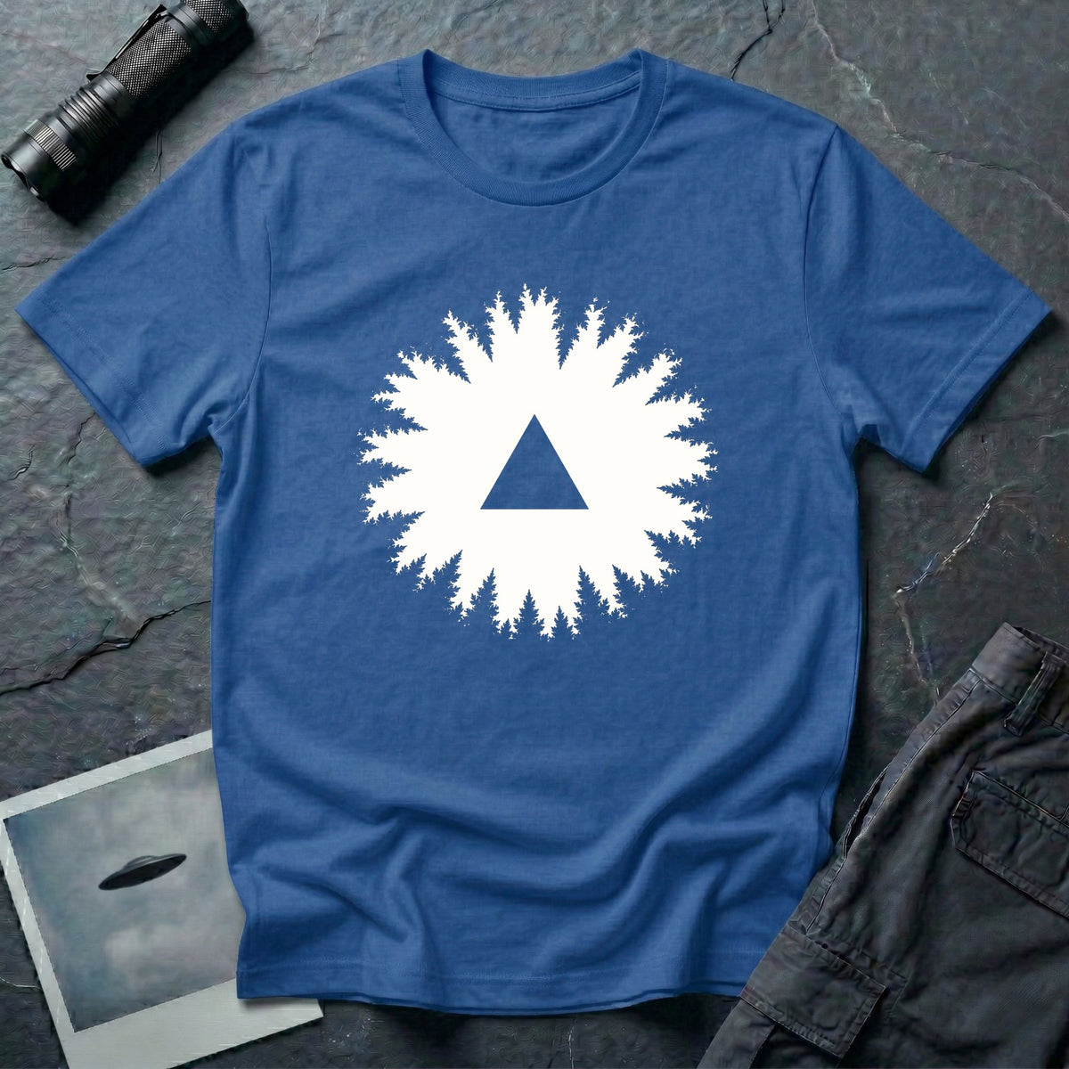 Black triangle UFO t-shirt, view looking straight up through a ring of forest treetops at a black triangular craft against ivory sky, royal blue