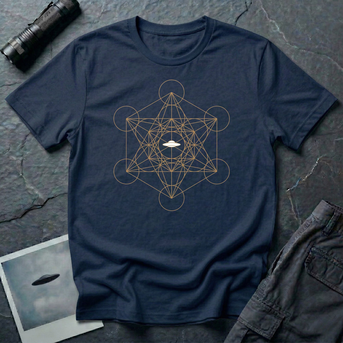 Navy blue t-shirt with gold Metatron's Cube sacred geometry design and white UFO silhouette at the centre