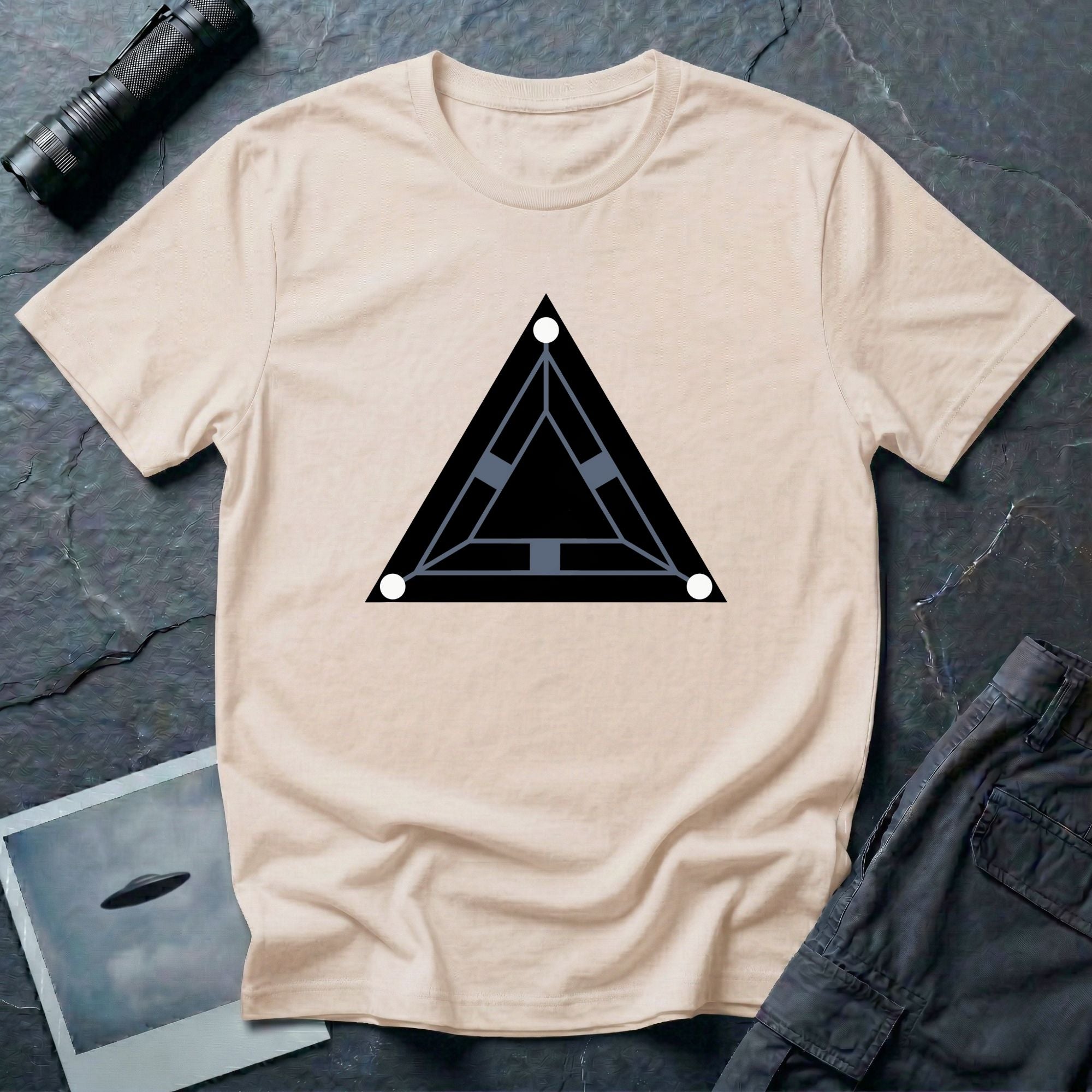 Minimalist black triangle UAP t-shirt with schematic underside view and three corner lights, natural