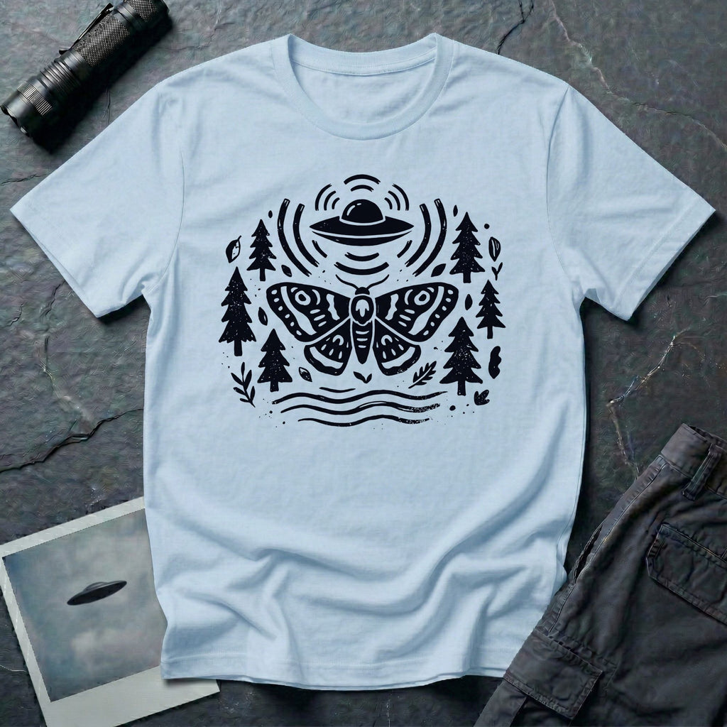 Moth and UFO T-shirt with a folk-art moth beneath a flying saucer, surrounded by pine trees, leaves and radiating signal lines, on light blue t-shirt