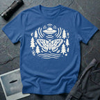 Moth and UFO T-shirt with a folk-art moth beneath a flying saucer, surrounded by pine trees, leaves and radiating signal lines, on royal blue t-shirt