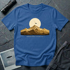 T-shirt with gold engraved mountain range under a moon and UFO with Mountain Return Cascades 1947 caption, royal blue