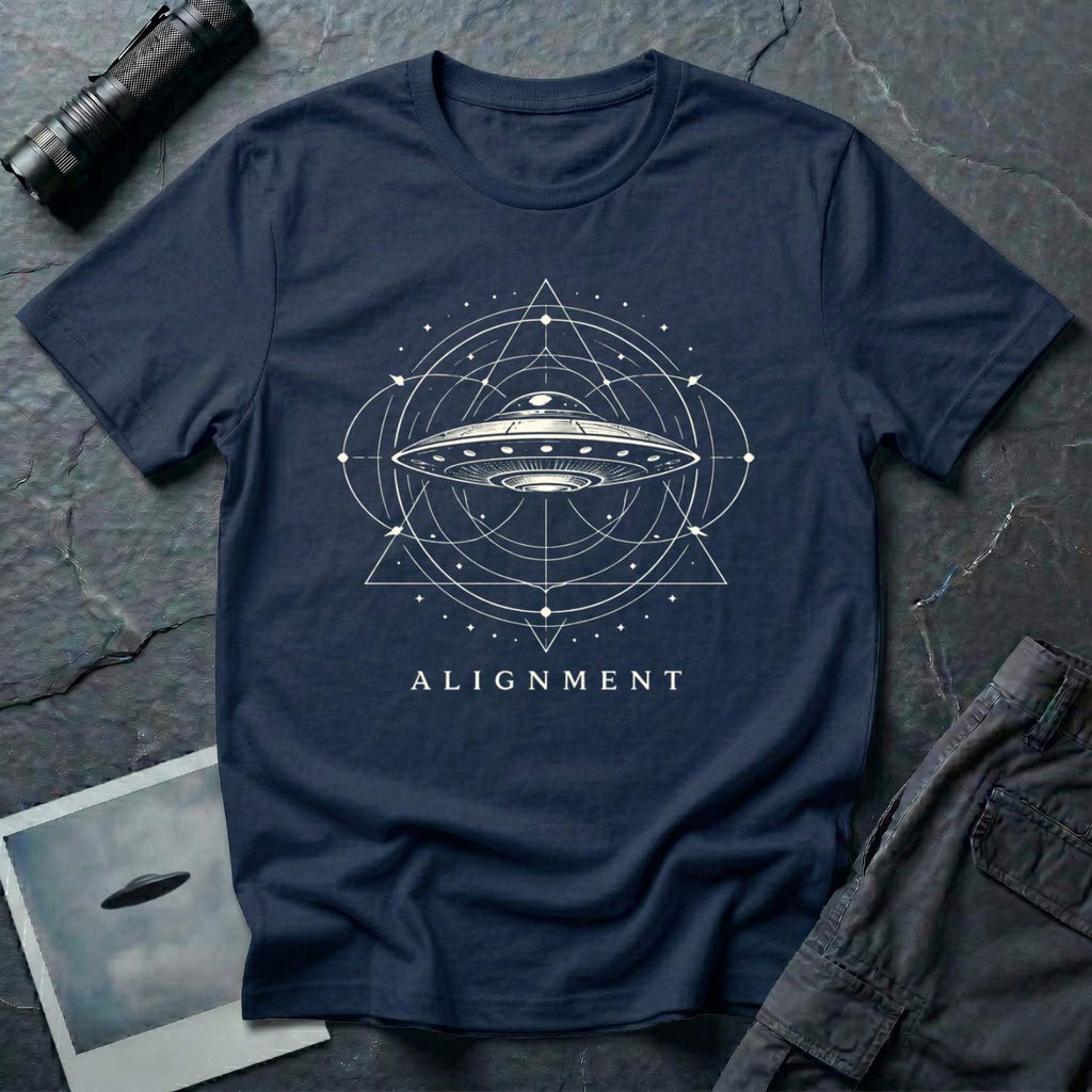 Alignment sacred geometry UFO t-shirt — flying saucer at the centre of a cosmological diagram with triangles and orbital rings in cream on navy blue cotton tee