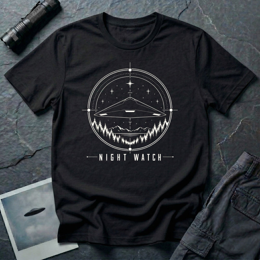 Night Watch UAP T-shirt with a black triangle craft hovering above a pine forest and mountains inside a celestial observation circle on black tee