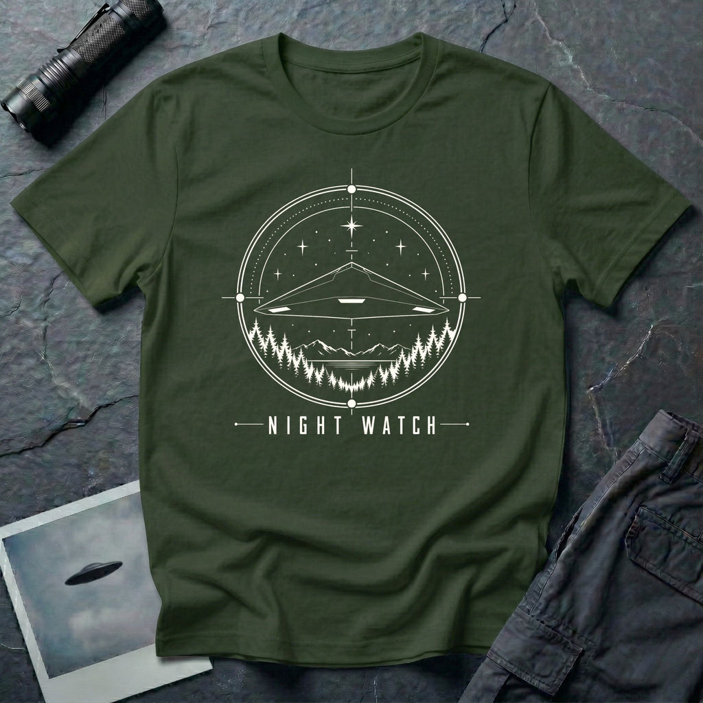 Night Watch UAP T-shirt with a black triangle craft hovering above a pine forest and mountains inside a celestial observation circle on military green tee