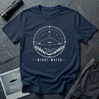 Night Watch UAP T-shirt with a black triangle craft hovering above a pine forest and mountains inside a celestial observation circle on navy blue tee