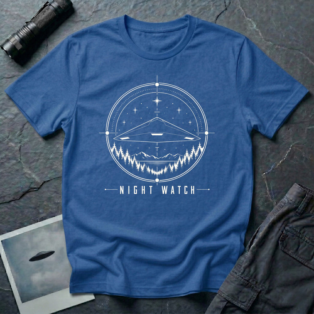 Night Watch UAP T-shirt with a black triangle craft hovering above a pine forest and mountains inside a celestial observation circle on royal blue tee
