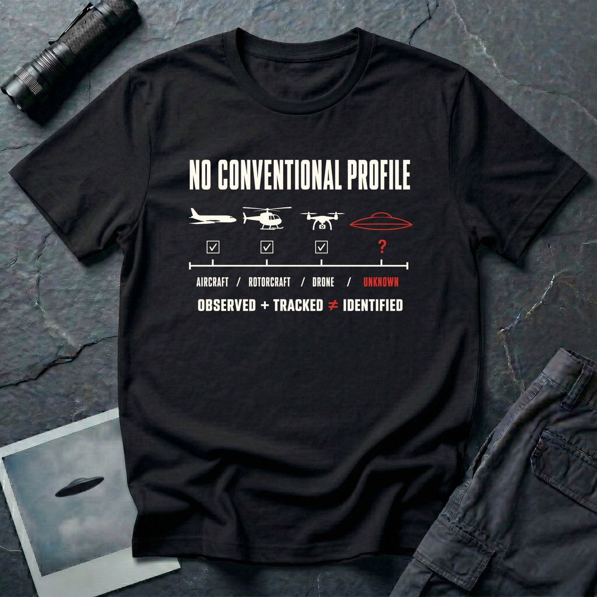 Aircraft, helicopter, and drone icons checked off against an unmarked UFO outline with Observed Plus Tracked Does Not Equal Identified text on a black t-shirt