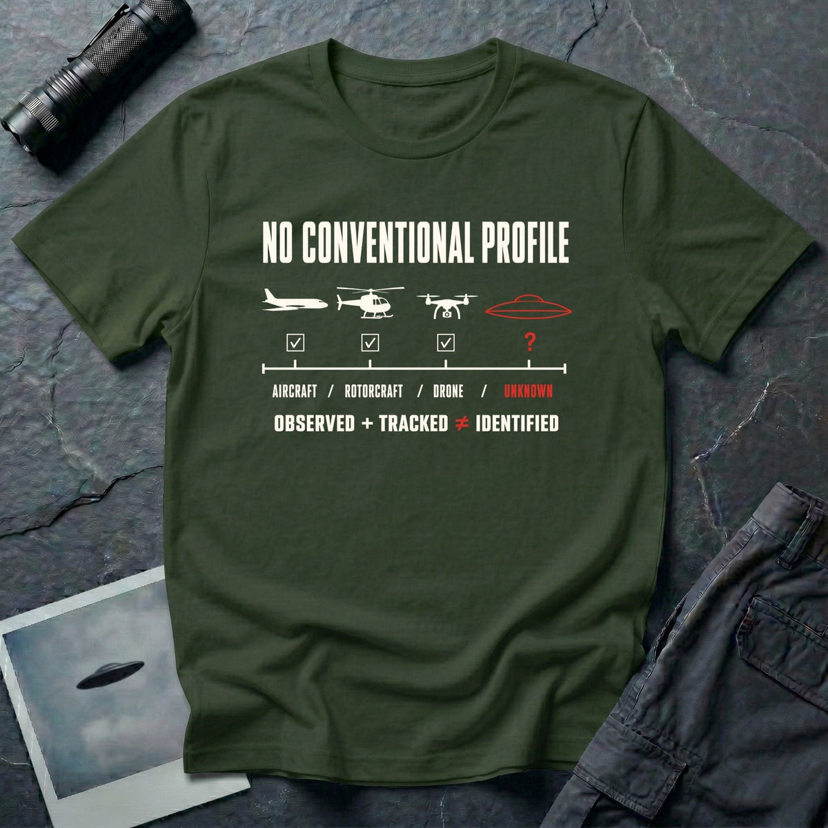 Aircraft, helicopter, and drone icons checked off against an unmarked UFO outline with Observed Plus Tracked Does Not Equal Identified text on a military green t-shirt