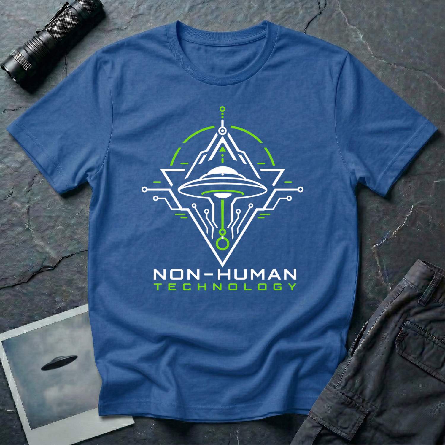 Blue t-shirt with geometric diamond frame circuit board UAP UFO schematic design in white and green with NON-HUMAN TECHNOLOGY text