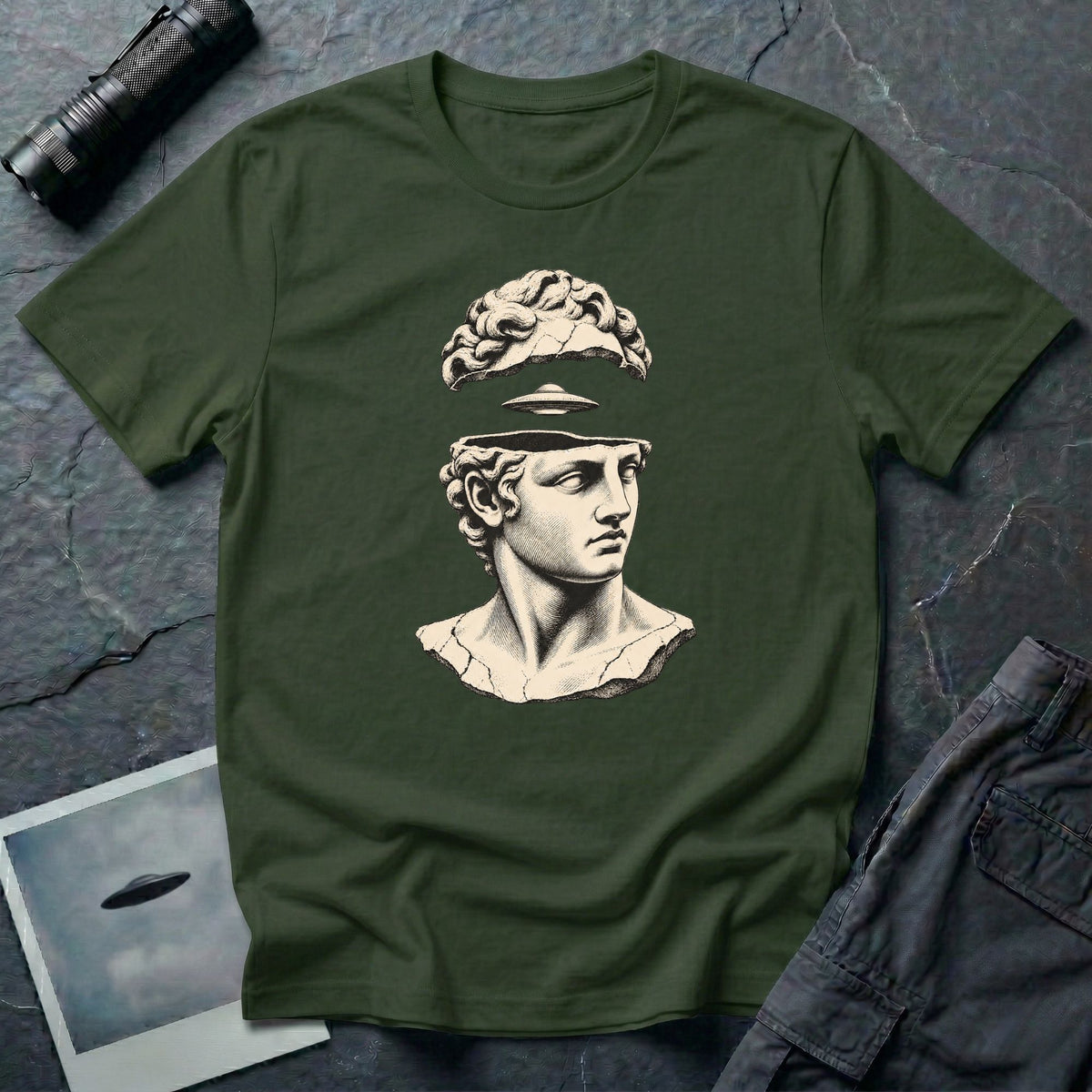 Classical marble bust with the top of the head lifted to reveal a UFO emerging, in cream engraving linework on a military green t-shirt