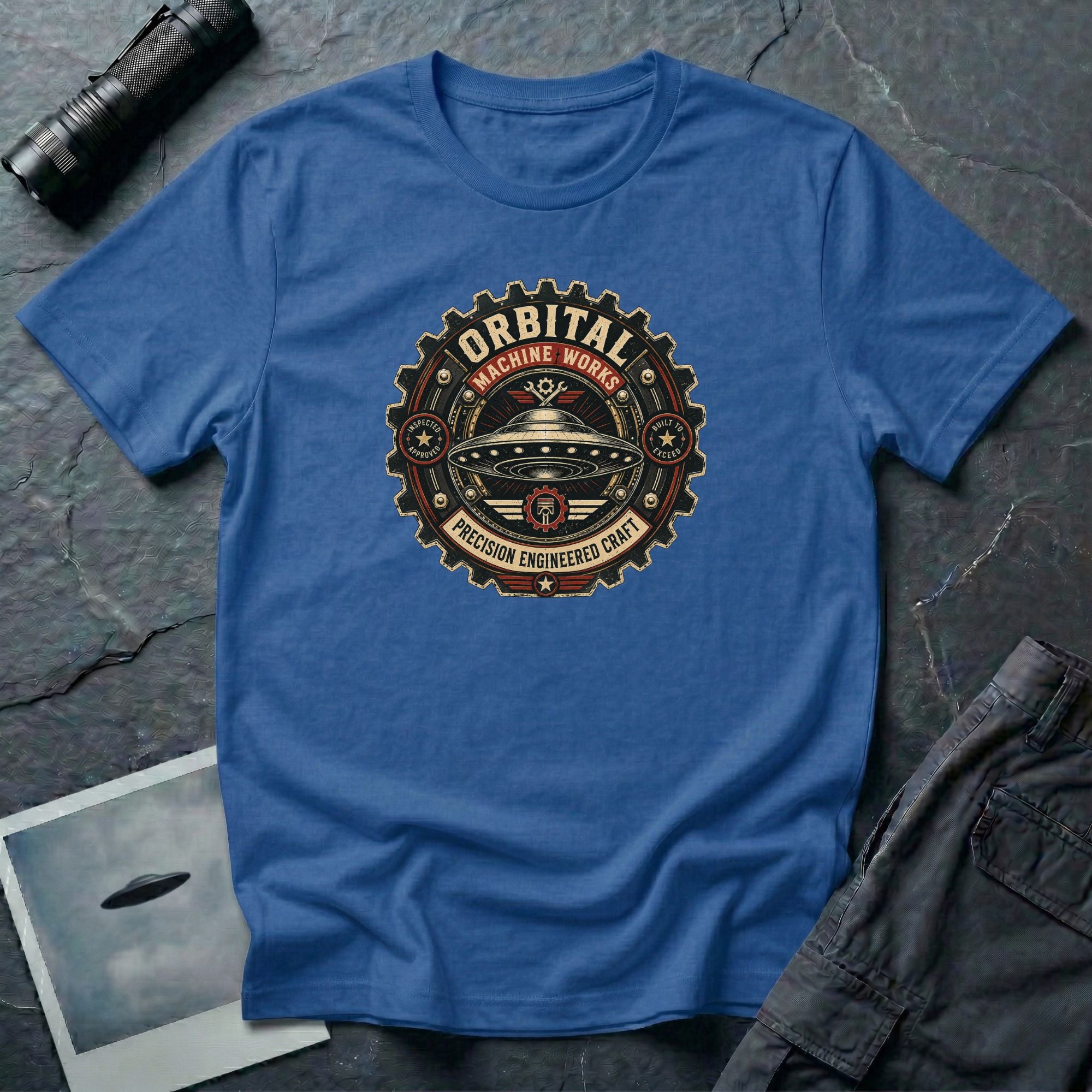 Orbital Machine Works UFO patch t-shirt with riveted saucer in vintage gear wheel emblem, royal blue