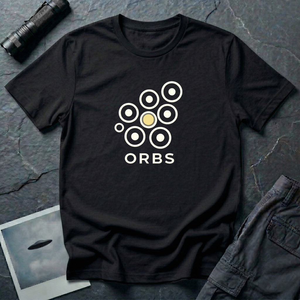 Orbs UFO t-shirt, seven ring-and-dot circles in a rosette pattern with one solid gold orb, above bold ORBS text, black