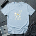 Orbs UFO t-shirt, seven ring-and-dot circles in a rosette pattern with one solid gold orb, above bold ORBS text, light blue