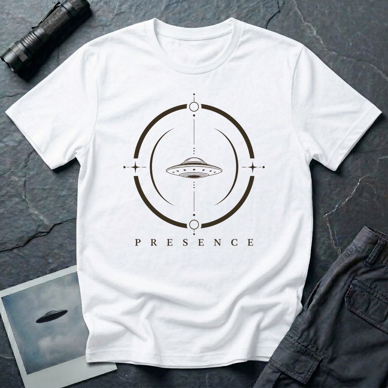 White UFO t-shirt with a flying saucer inside a broken circular frame with the word PRESENCE beneath