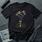 Stencil UFO t-shirt design, child reaching up to hold strings tethered to a small fleet of UFOs, orange wildflowers at the base, black tee