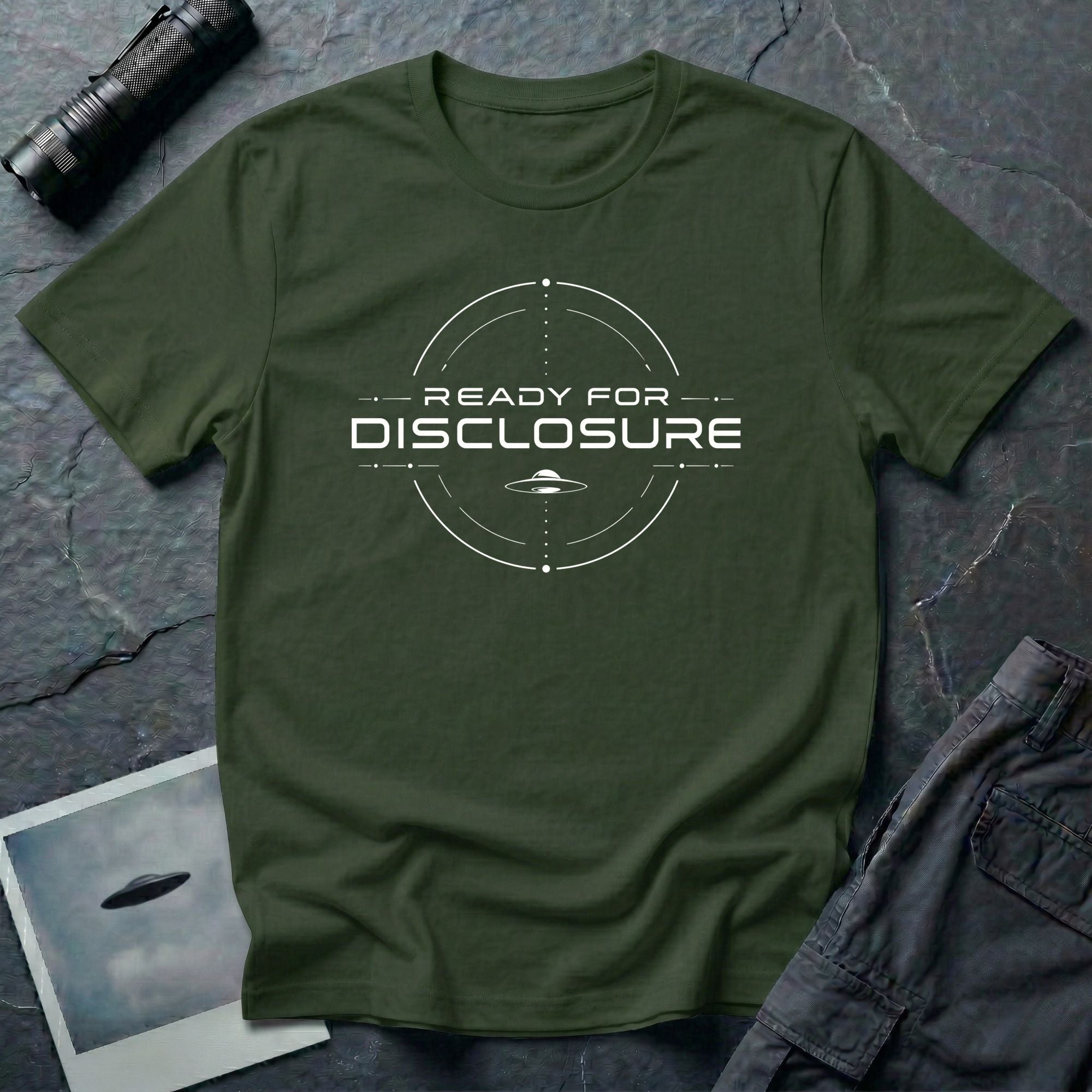 Military green UFO disclosure t-shirt with a targeting reticle crosshair and the words READY FOR DISCLOSURE in white tech typography with a small flying saucer