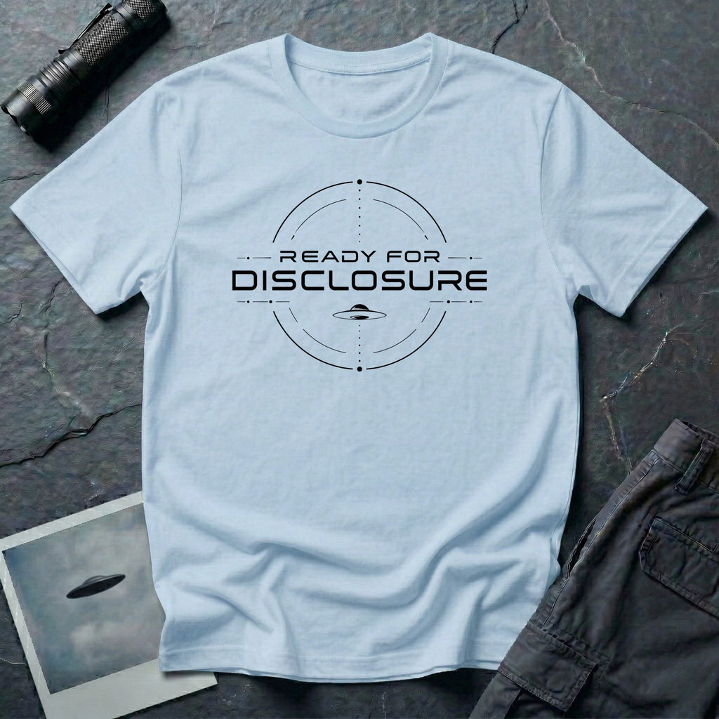 Light blue UFO disclosure t-shirt with a targeting reticle crosshair and the words READY FOR DISCLOSURE in black tech typography with a small flying saucer