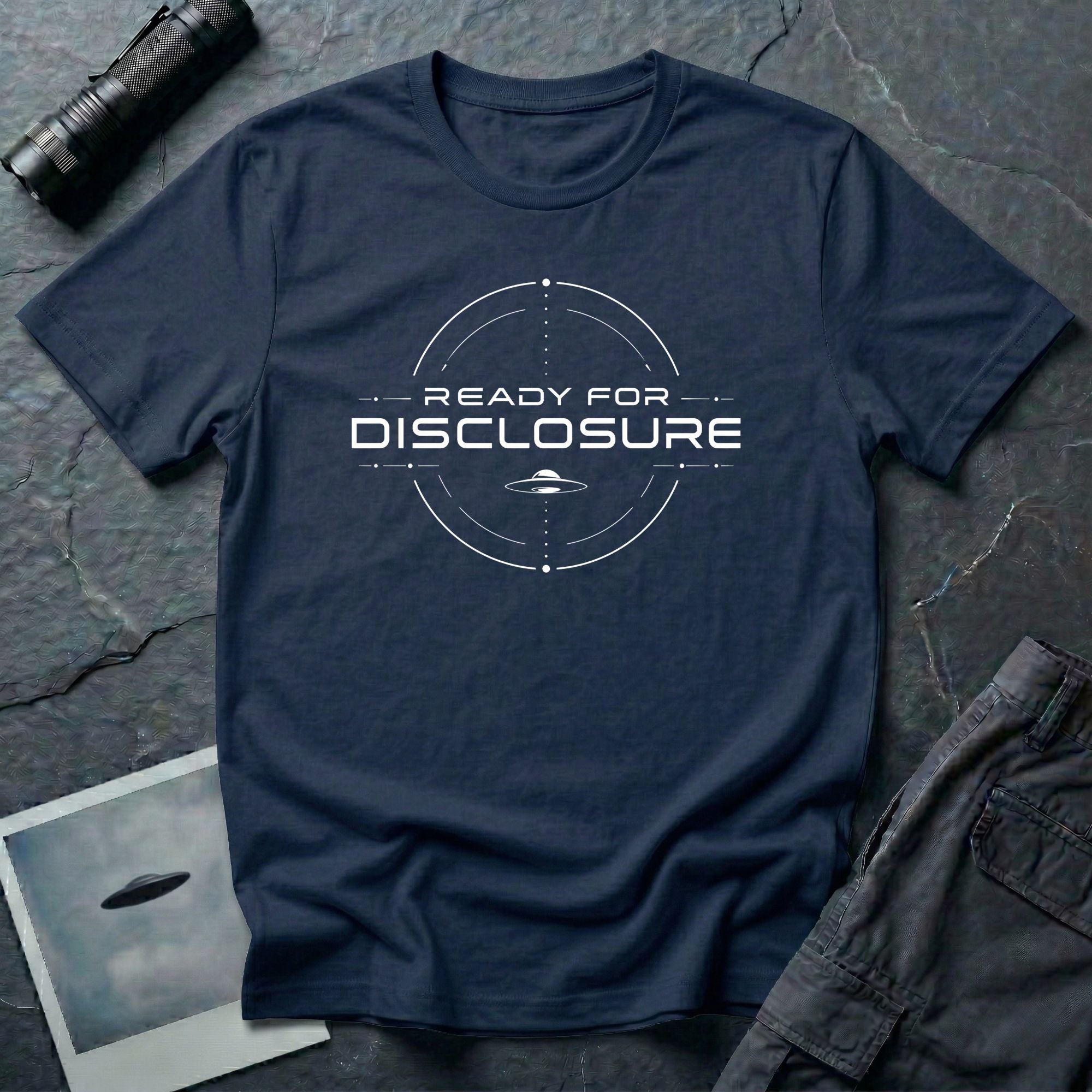 Navy blue UFO disclosure t-shirt with a targeting reticle crosshair and the words READY FOR DISCLOSURE in white tech typography with a small flying saucer