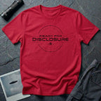 Red UFO disclosure t-shirt with a targeting reticle crosshair and the words READY FOR DISCLOSURE in black tech typography with a small flying saucer