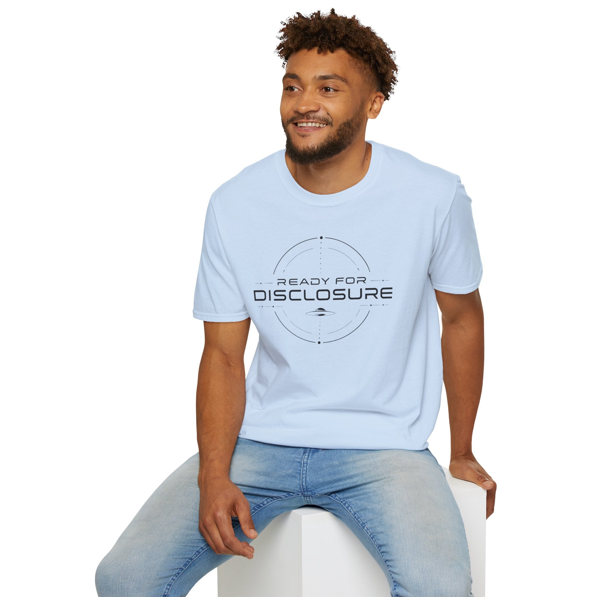 Man in light blue UFO disclosure t-shirt with a targeting reticle crosshair and the words READY FOR DISCLOSURE in black tech typography with a small flying saucer