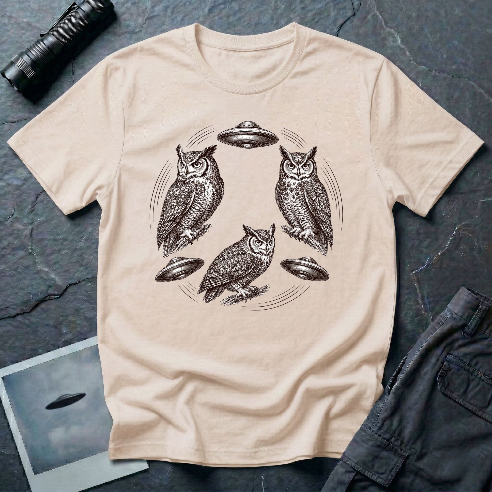 Silent Wings Owl UFO t-shirt with three engraved owls and three saucers in a circular design, natural