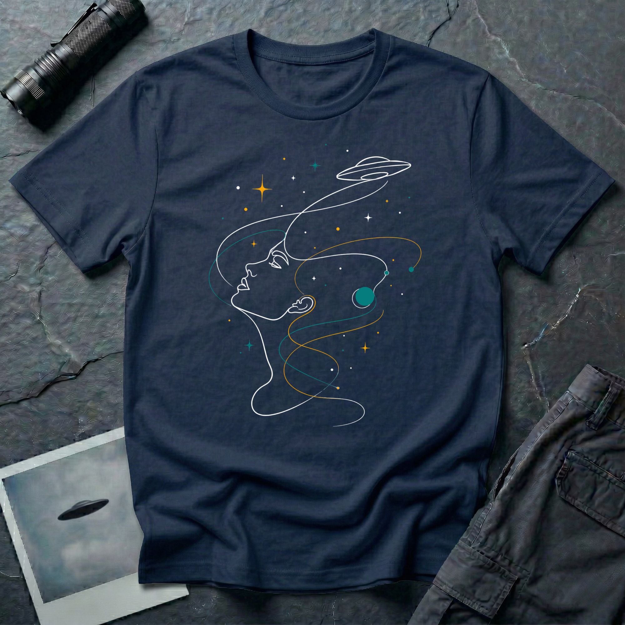 Sky Dreamer UFO t-shirt with single-line art of a woman gazing up at a saucer with stars, navy blue