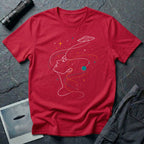 Sky Dreamer UFO red t-shirt with single-line art of a woman gazing up at a saucer with stars, red