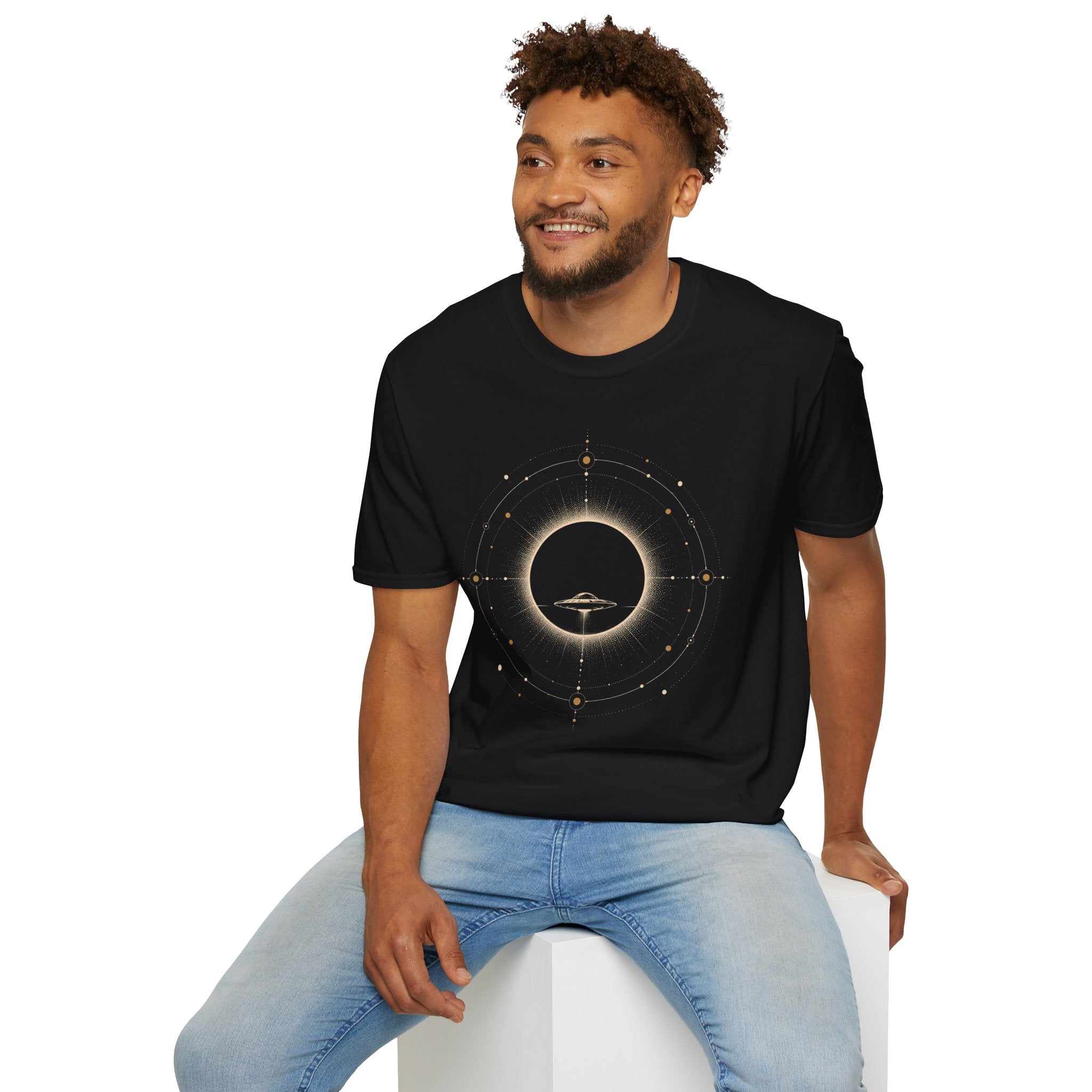 Man in black UFO t-shirt with saucer silhouette inside solar eclipse and orbital sacred geometry design