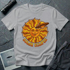 Solar Eclipse retro UFO t-shirt — smiling 1970s sun with flying saucer photobombing on grey unisex cotton tee