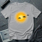 Solar Fly-by artistic UFO t-shirt — three black flying saucers passing across a glowing sun on grey unisex cotton tee