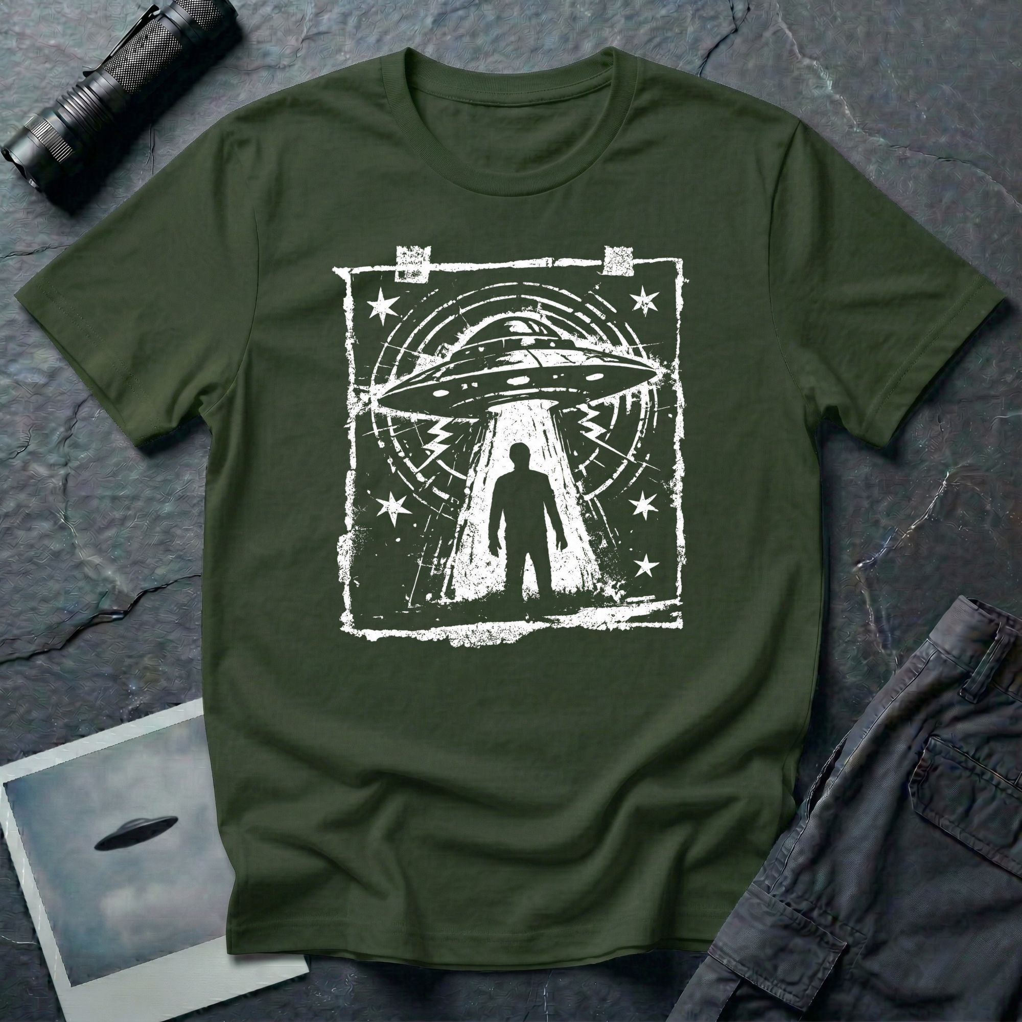 Green UFO t-shirt in styled as a distressed street flyer with saucer tractor beam and human silhouette