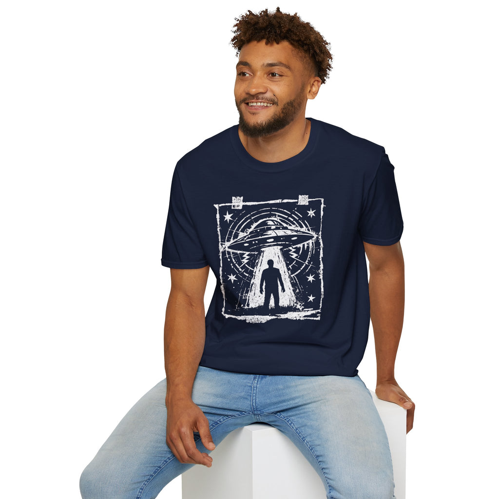 Man wearing navy blue UFO t-shirt with a distressed street flyer graphic with saucer tractor beam and human silhouette