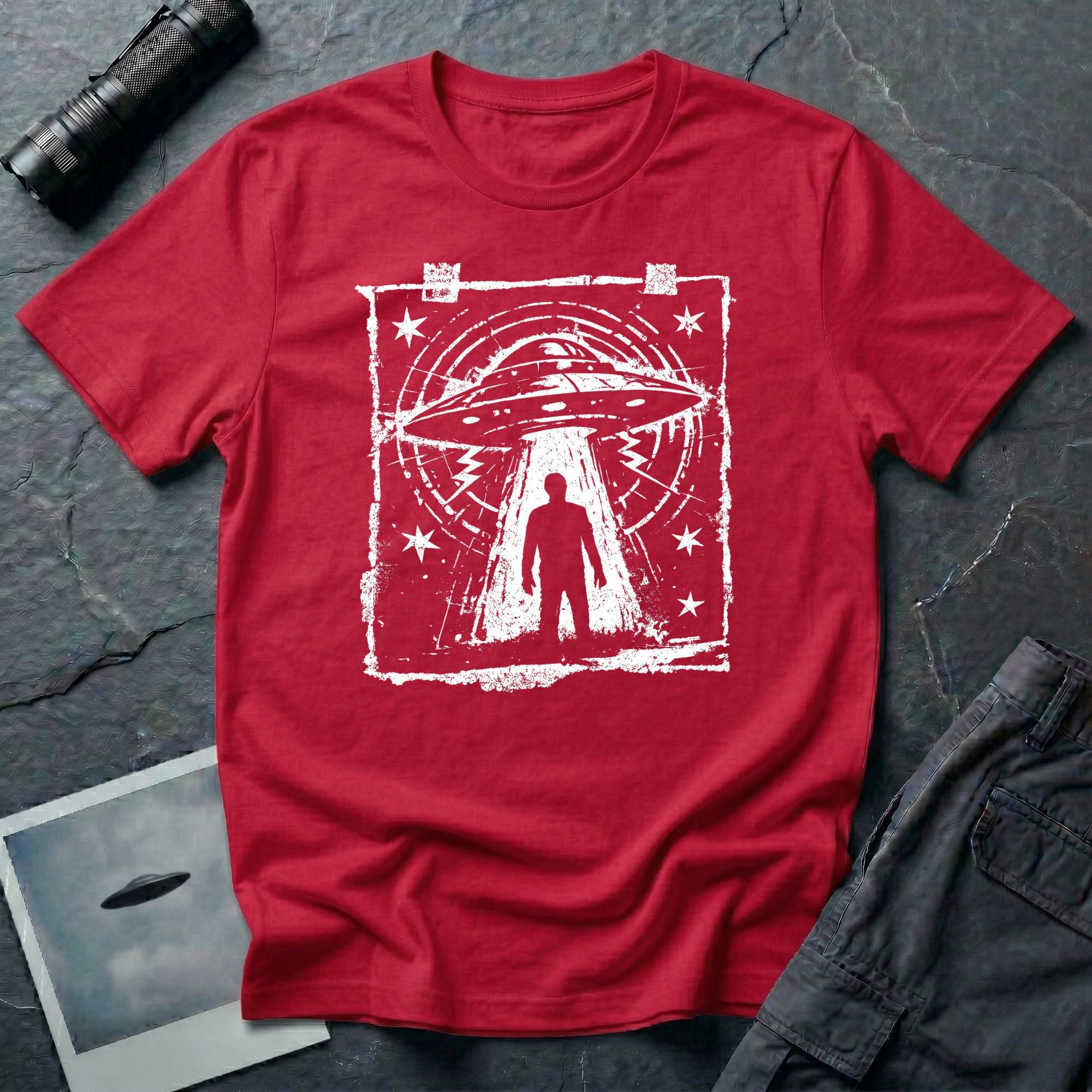 Red UFO t-shirt in featuring distressed street flyer design with saucer tractor beam and human silhouette
