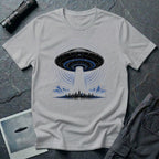 Grey UFO t-shirt with massive mothership beaming light over city skyline at night