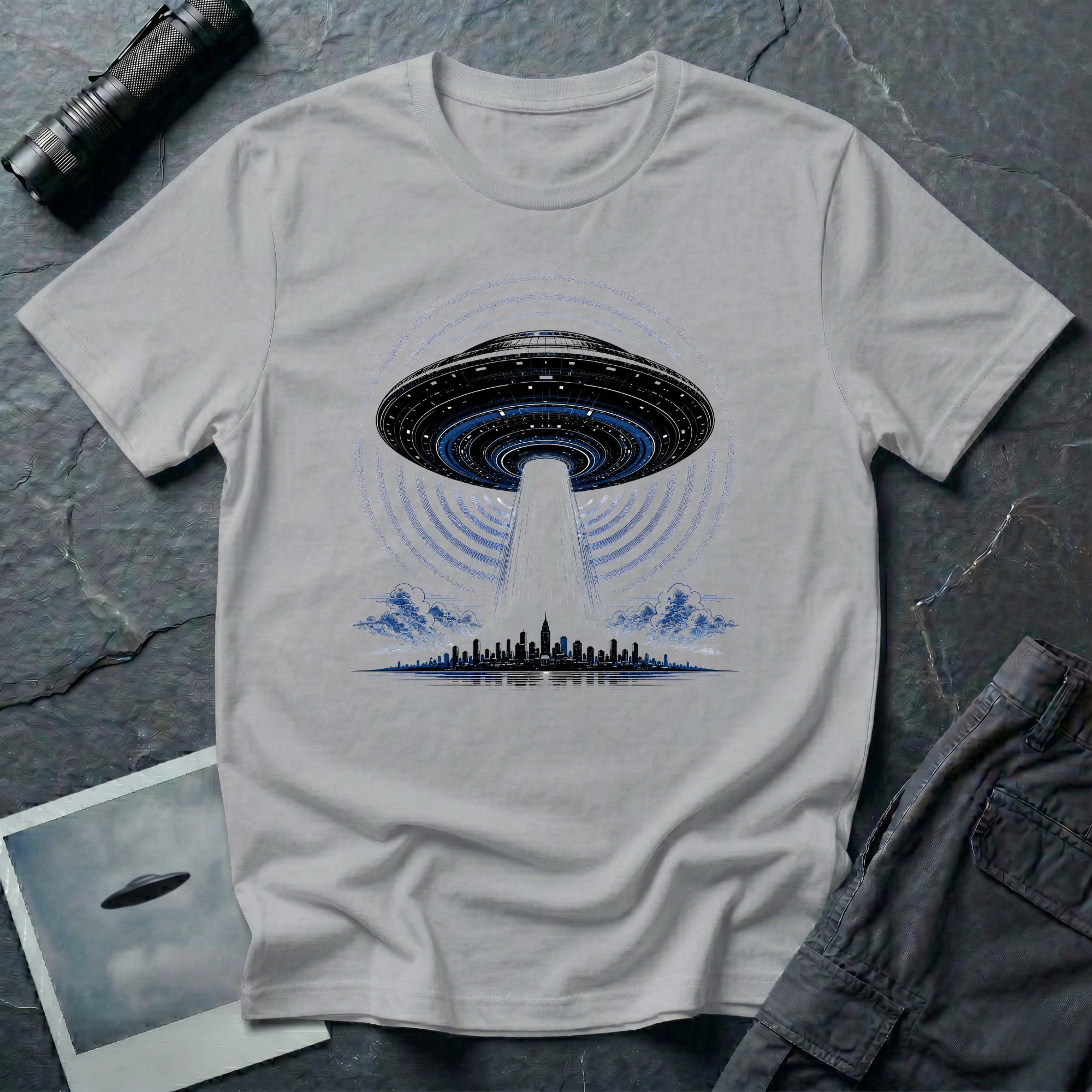 Grey UFO t-shirt with massive mothership beaming light over city skyline at night