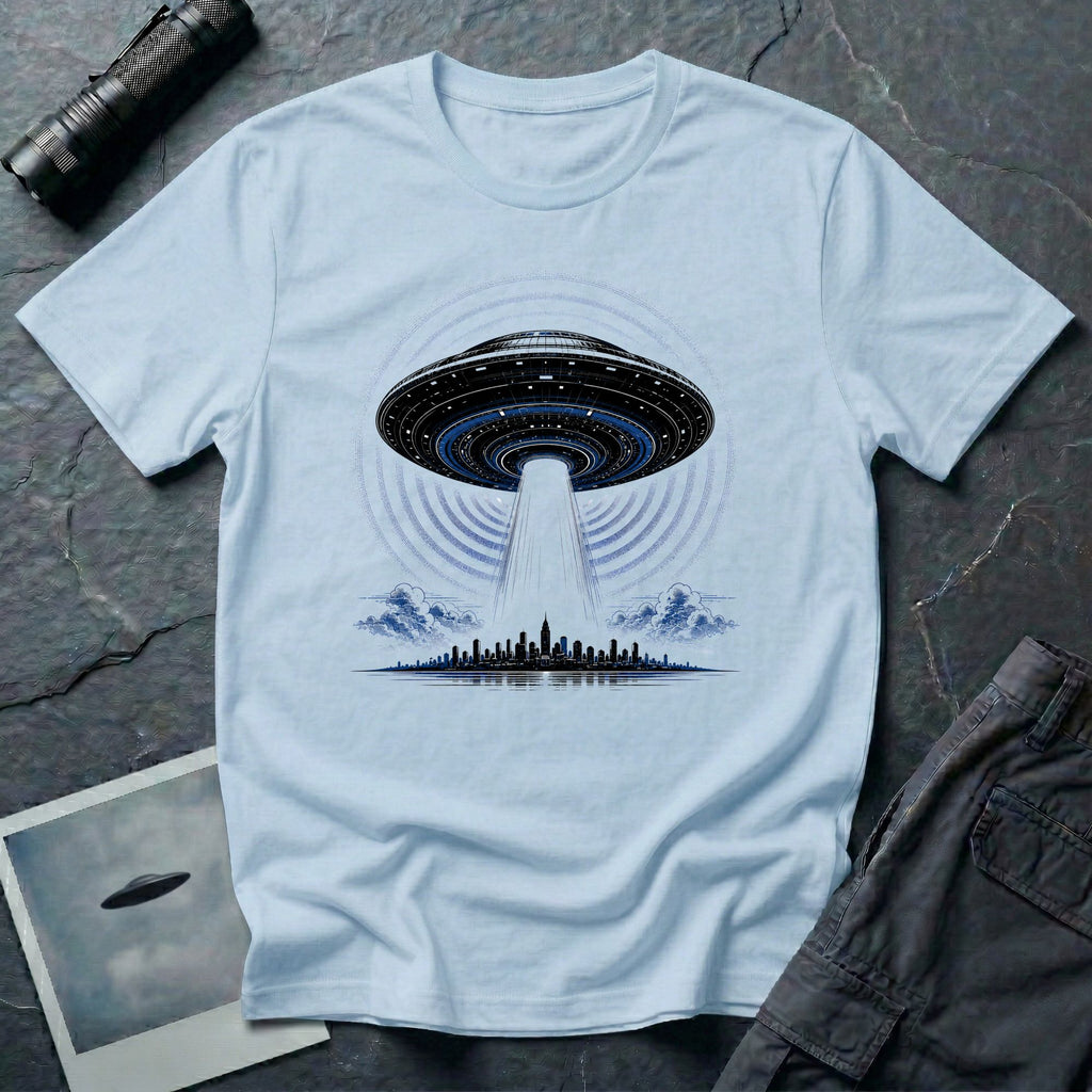 Light blue UFO t-shirt with massive mothership beaming light over city skyline at night